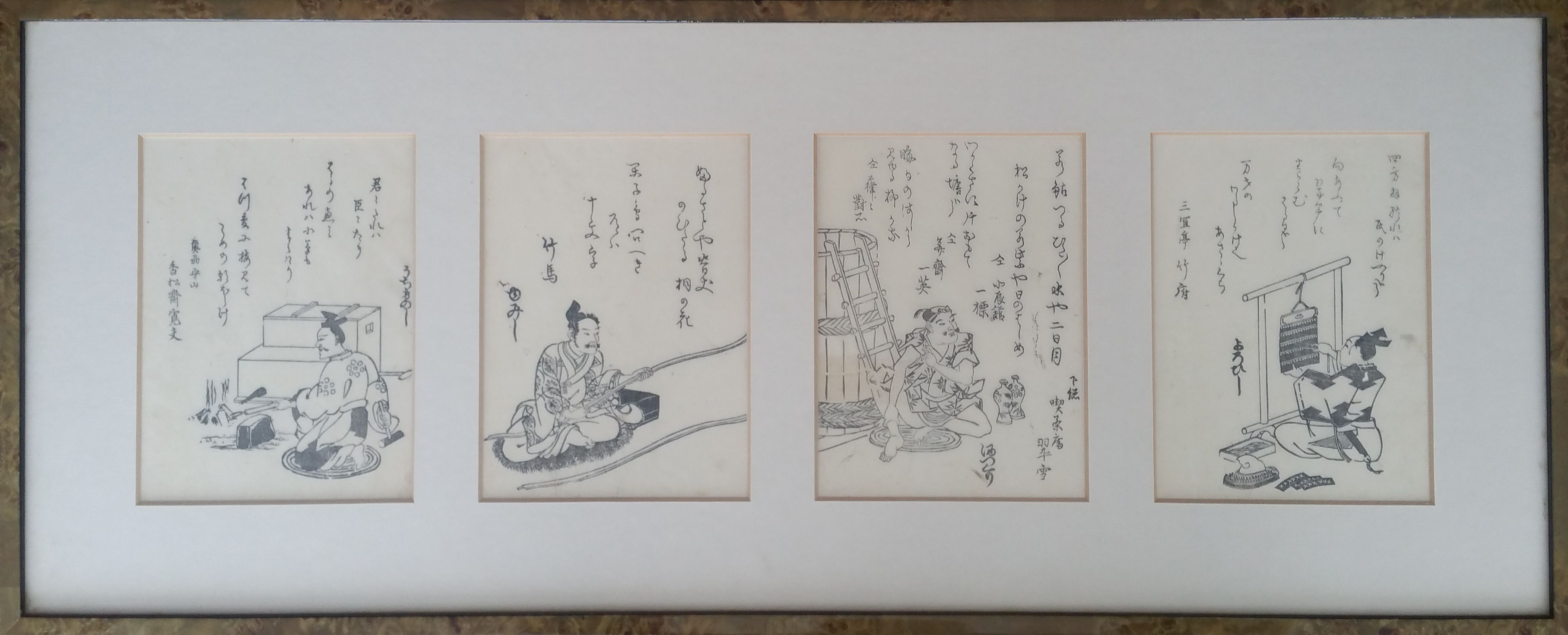 Four Japanese prints framed together.